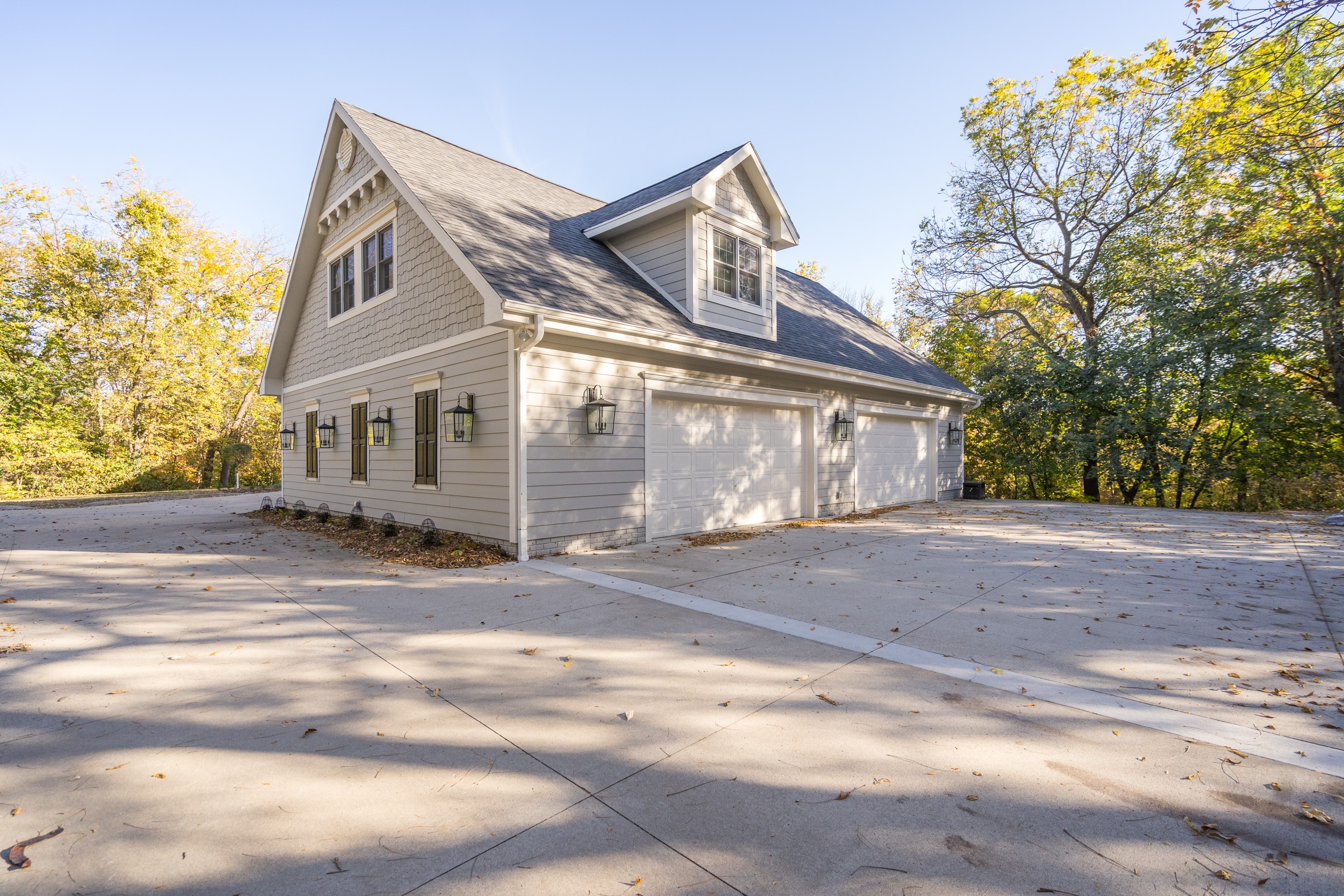 Carriage house style garage with dormers