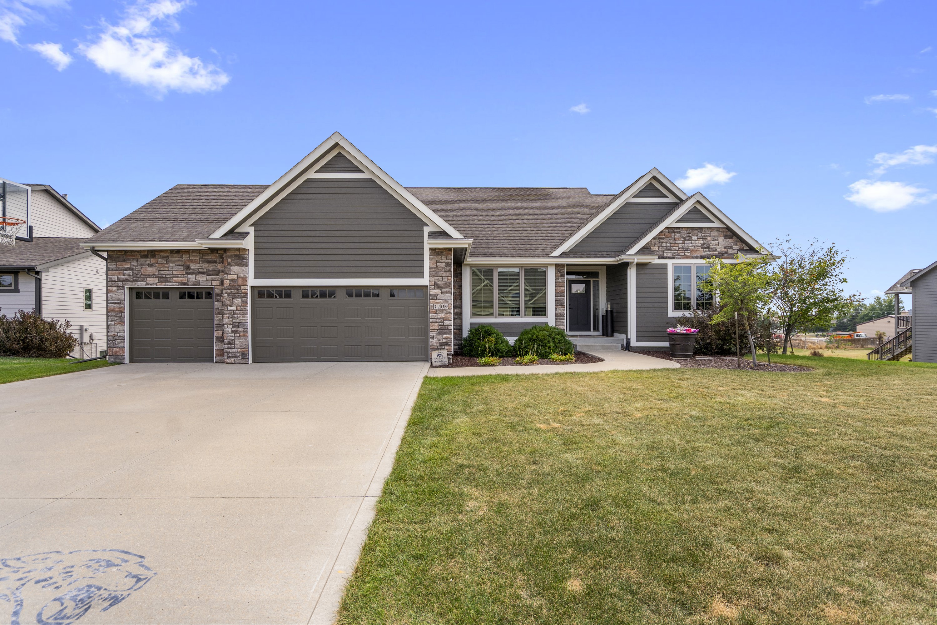 Custom home with three-car garage and covered entry