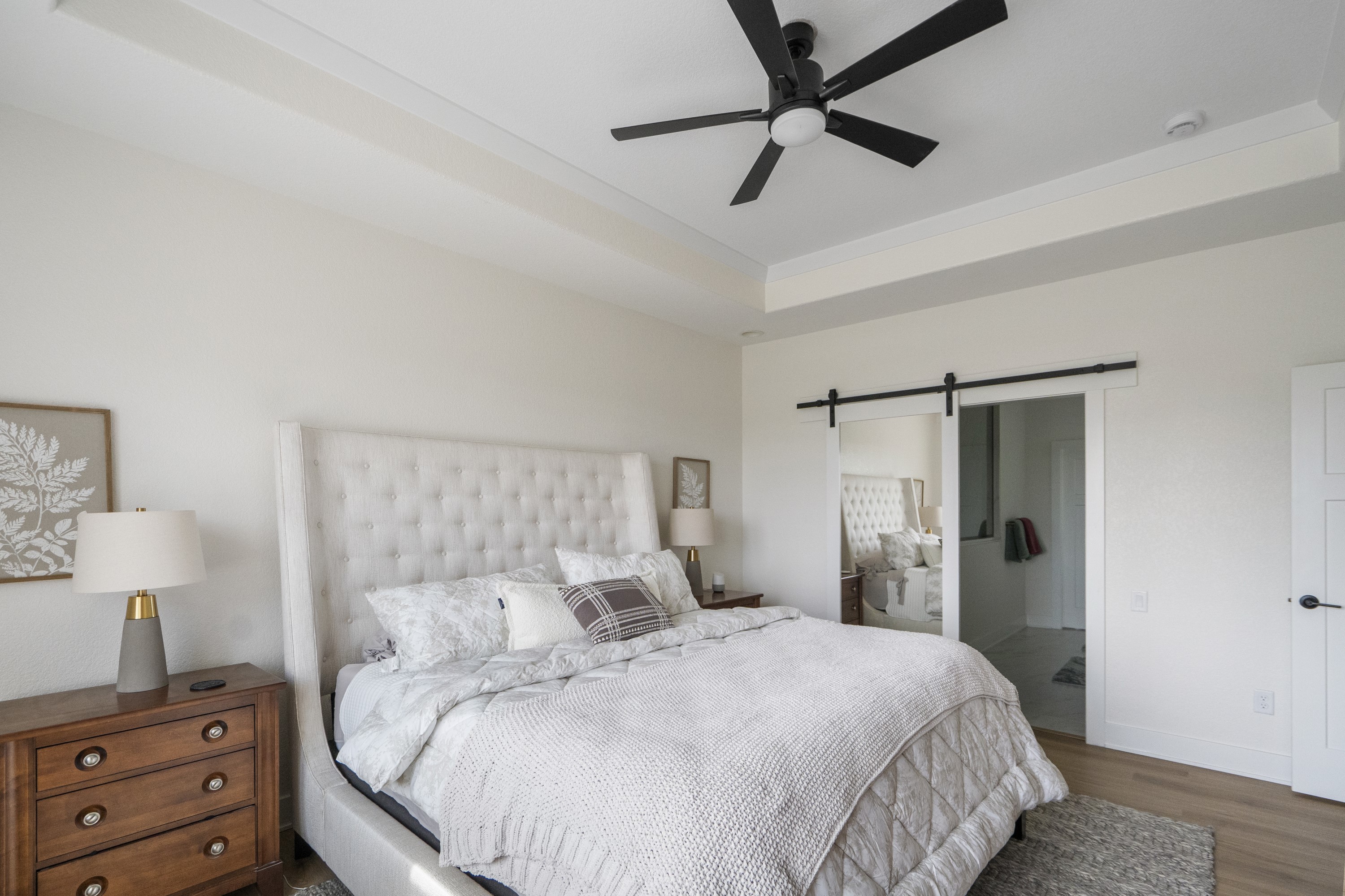 Master bedroom with barn door to ensuite
