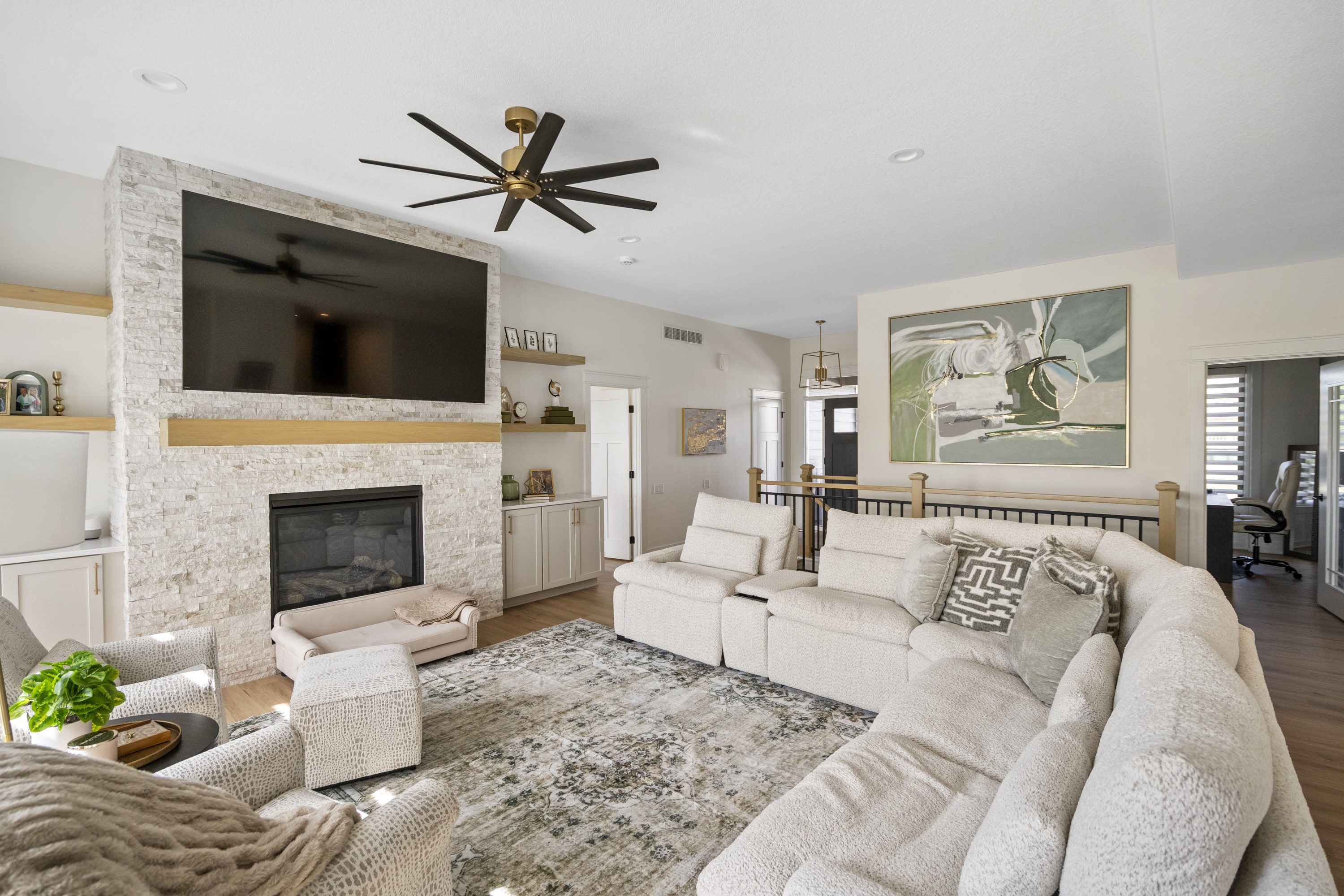 Living space with stacked stone fireplace