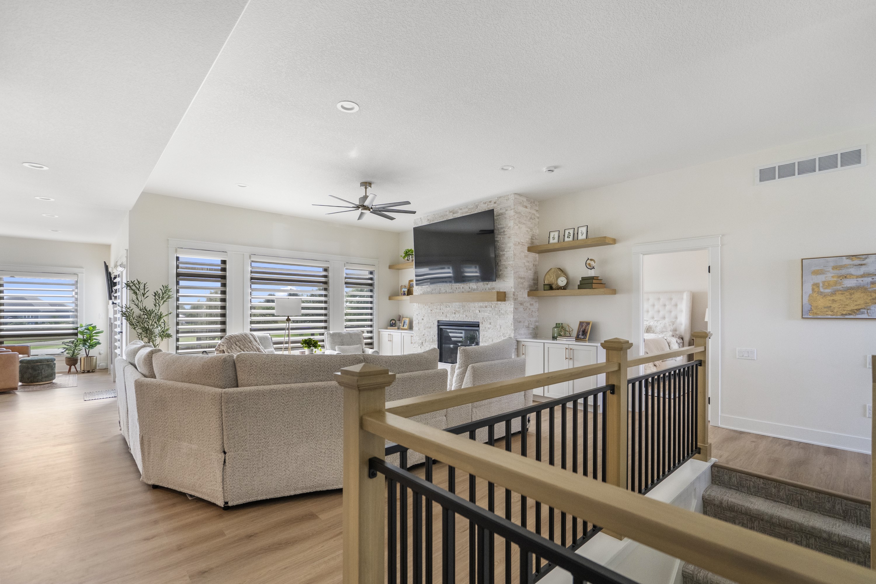 Open living room with staircase and fireplace