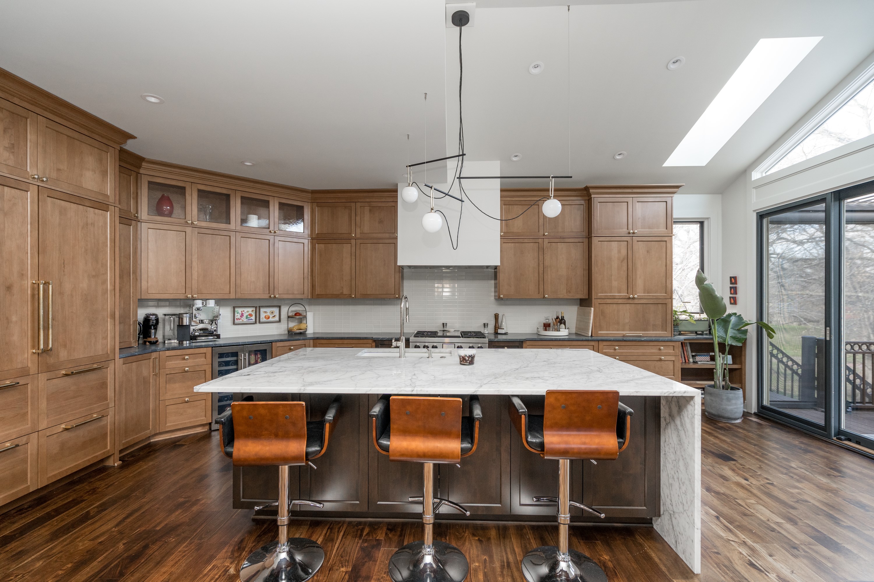 Kitchen with professional range and custom hood