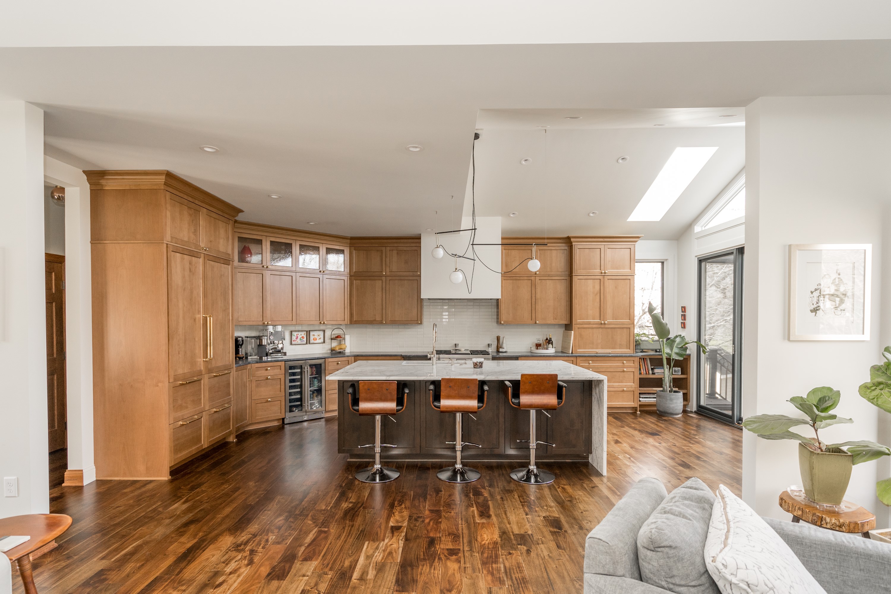 Living room with modern fireplace and wood floors