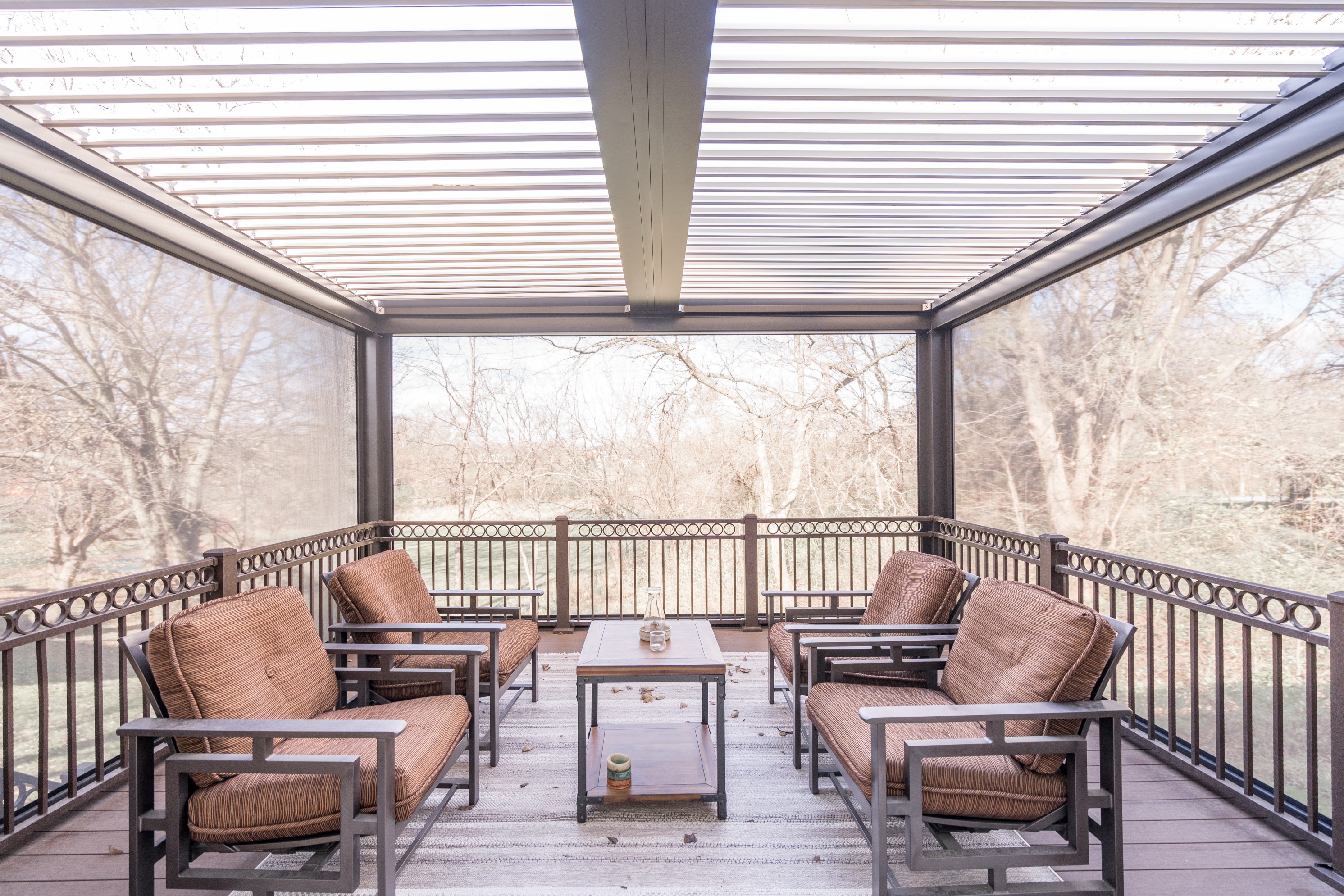 Covered pergola deck with louvered roof